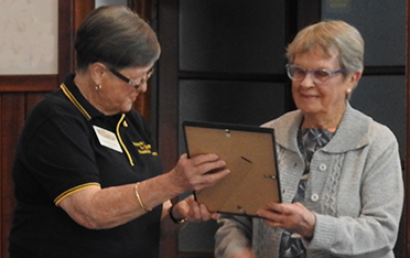 Molly Smith  received Award from President Elizabeth Shaw